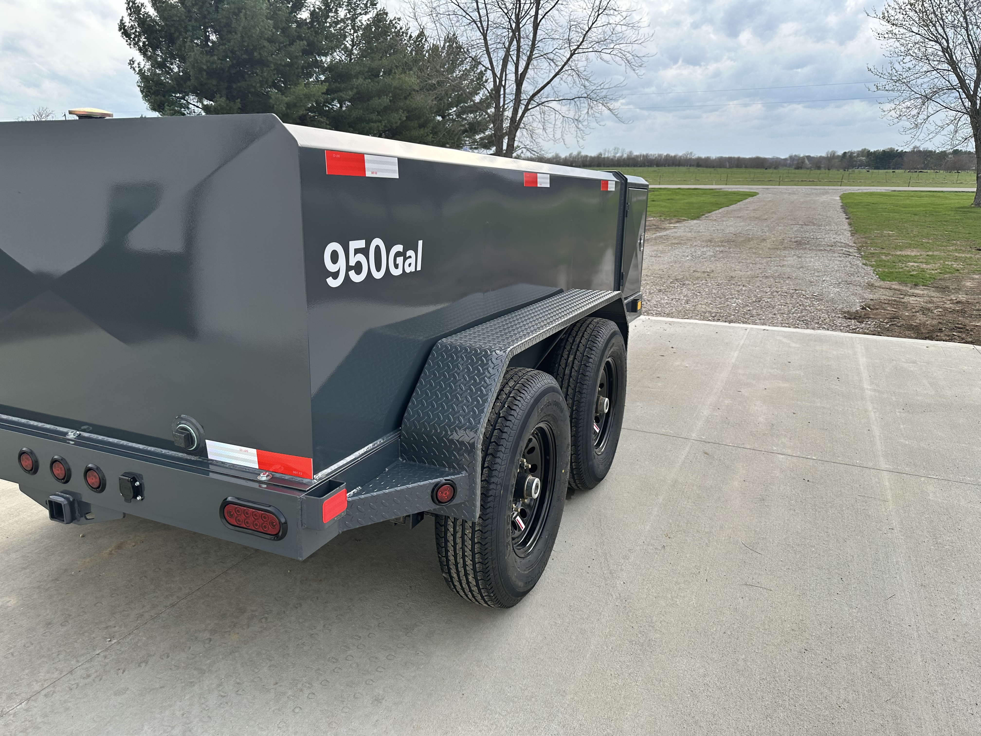 Custom green 750-gallon fuel trailer side view